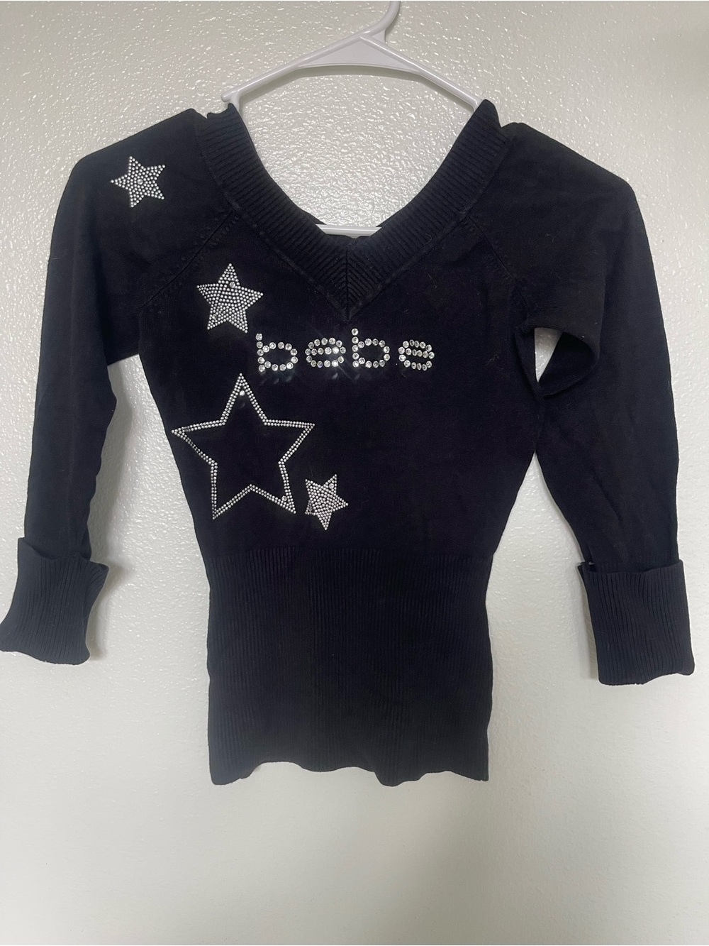 bebe Black Rhinestone Star V‑Neck Sweater